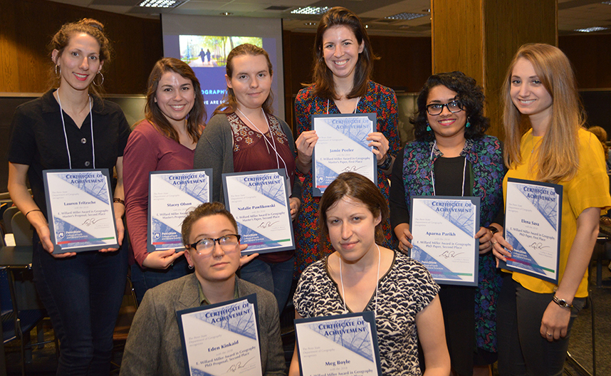 A group of students holding award certificates